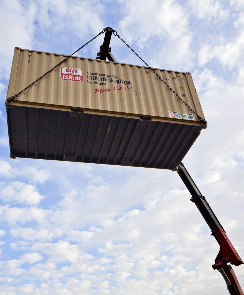big box mobile storage container lifted using crane for level delivery