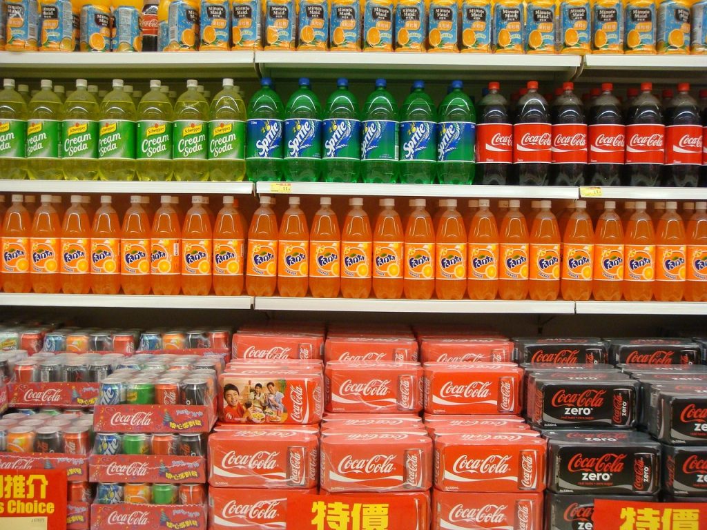 A picture of pop in a convenience store.